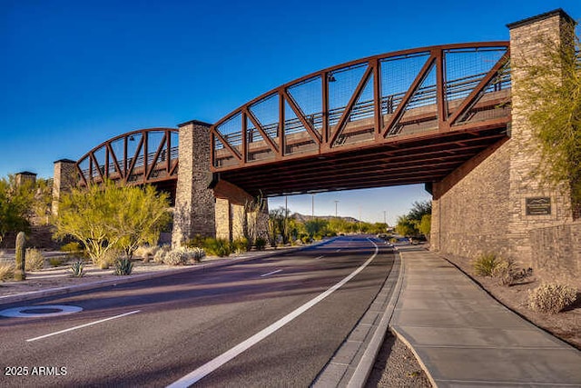 view of road with curbs and sidewalks