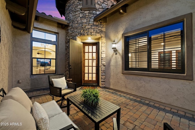 patio terrace at dusk with an outdoor hangout area