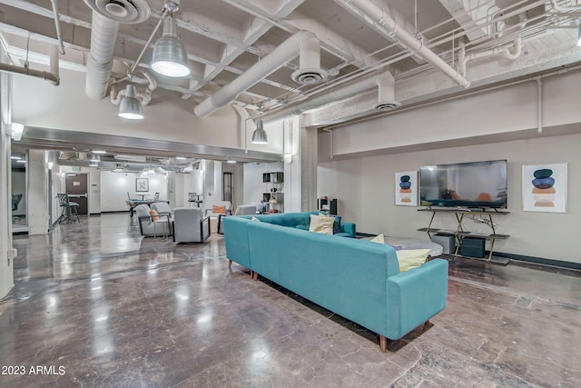 living room with concrete flooring