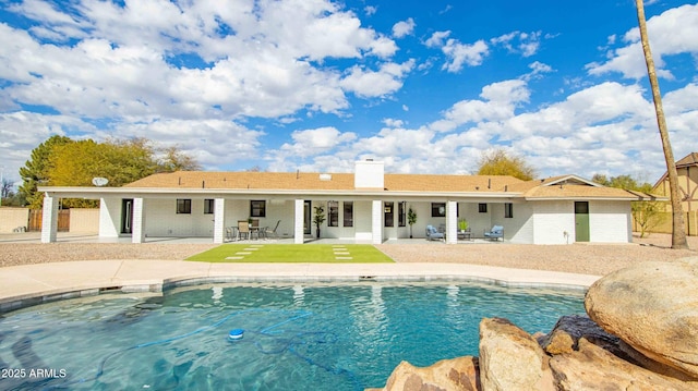 view of swimming pool featuring a patio area