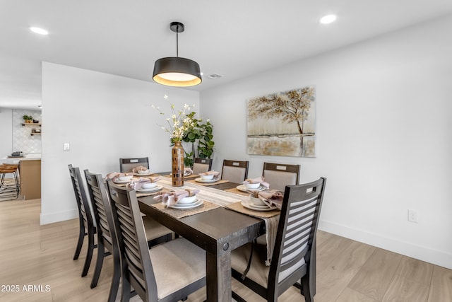 dining room with light wood-type flooring