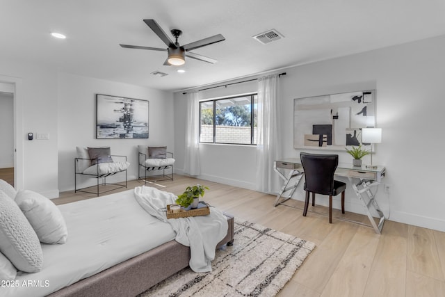 living room featuring ceiling fan and light wood-type flooring