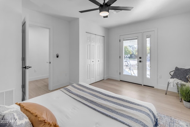 bedroom featuring access to outside, ceiling fan, and light hardwood / wood-style floors