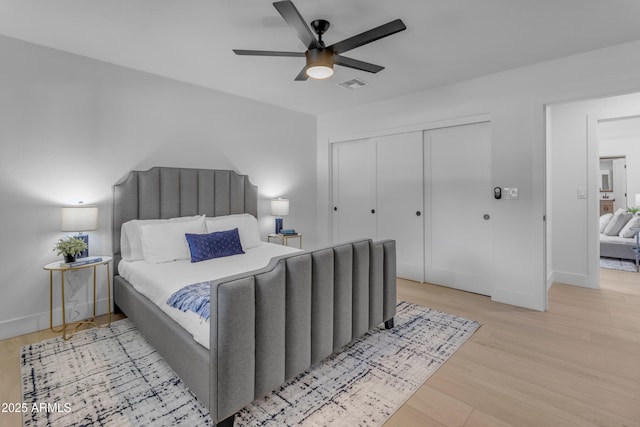 bedroom with ceiling fan and light hardwood / wood-style flooring