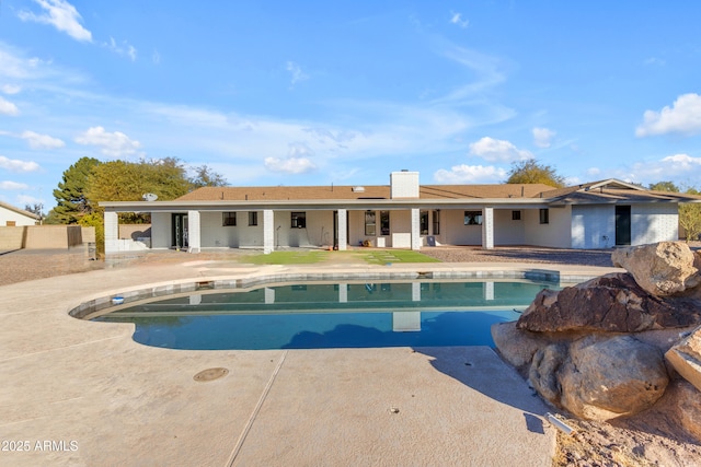 view of pool featuring a patio