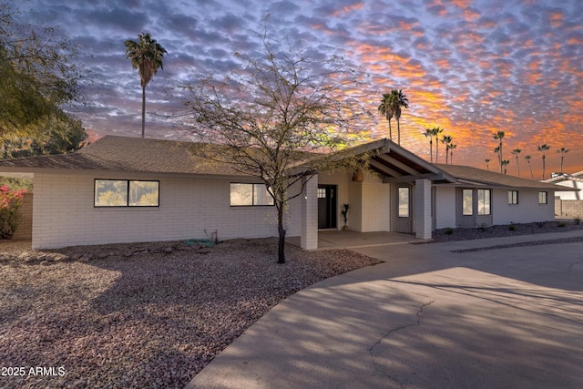 single story home featuring a carport