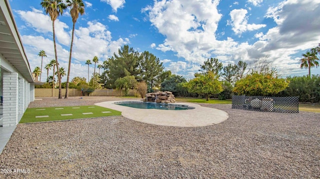 view of yard featuring a patio and a fenced in pool