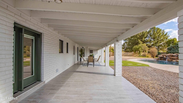 view of patio with pool water feature