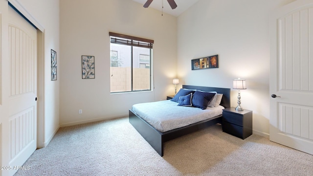 bedroom with carpet, baseboards, and ceiling fan