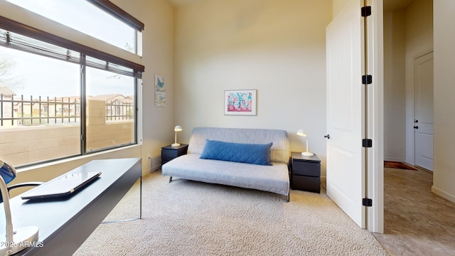 living room with carpet and baseboards