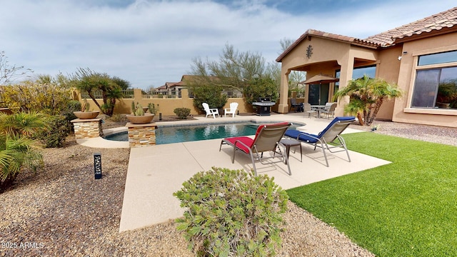 view of swimming pool featuring fence, a patio area, a fenced in pool, and grilling area