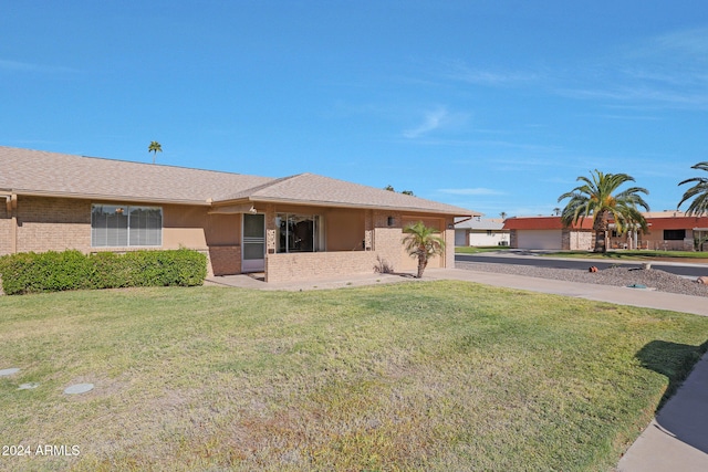 single story home with a front yard