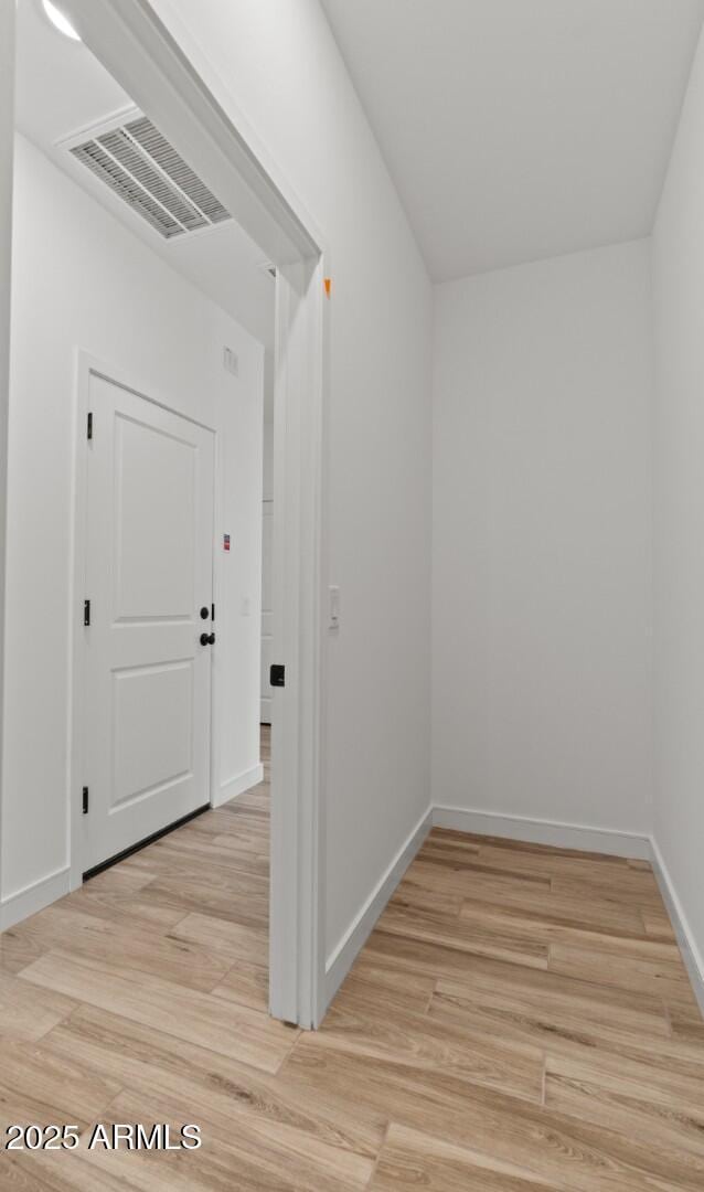 42405 W Peters Dr, Maricopa, AZ 85138 - corridor with light wood-style floors and baseboards