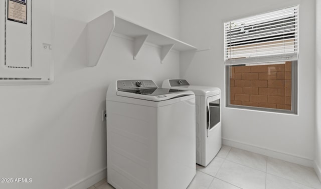 42405 W Peters Dr, Maricopa, AZ 85138 - clothes washing area with washing machine and clothes dryer, baseboards, and light tile patterned floors