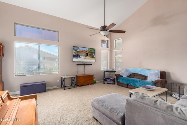 carpeted living room with high vaulted ceiling and ceiling fan