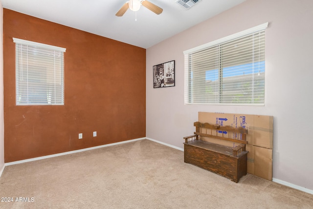 sitting room with light carpet and ceiling fan