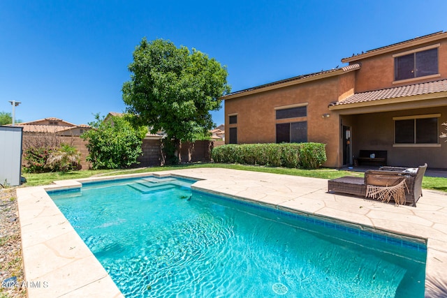 view of swimming pool featuring a patio