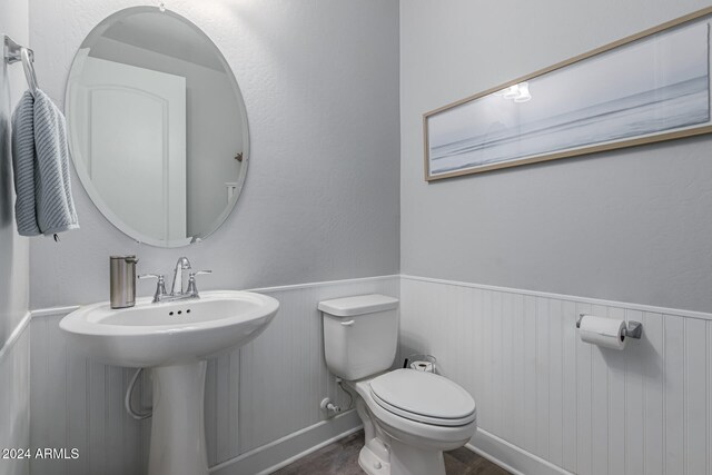 bathroom featuring sink and toilet