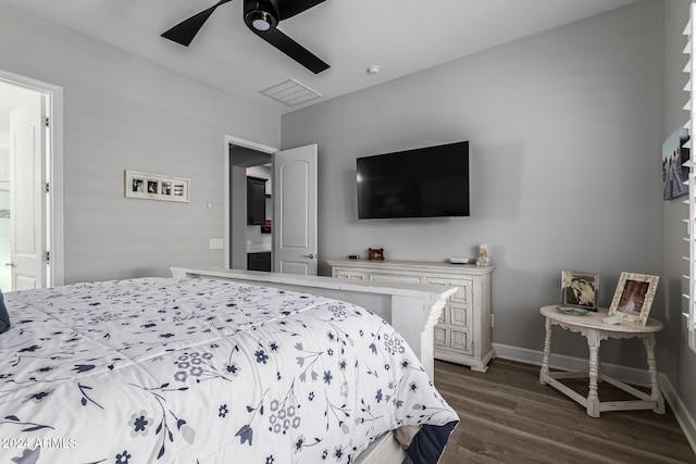 bedroom with dark hardwood / wood-style flooring and ceiling fan