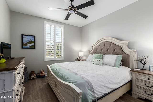 bedroom with dark wood-type flooring and ceiling fan