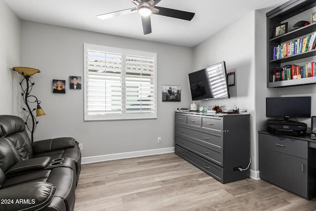 living area with ceiling fan and light hardwood / wood-style flooring