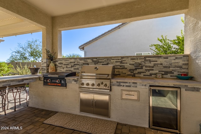 view of patio / terrace featuring grilling area and exterior kitchen