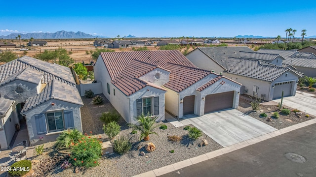 birds eye view of property featuring a mountain view