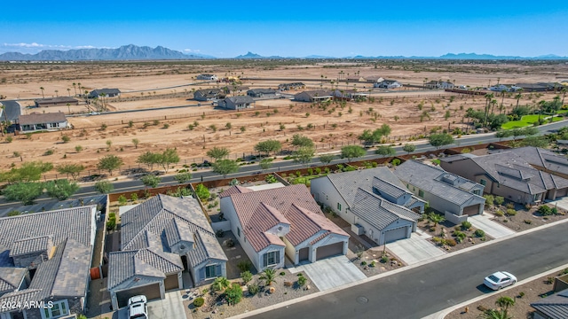 birds eye view of property featuring a mountain view