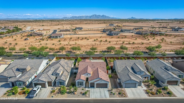 birds eye view of property featuring a mountain view