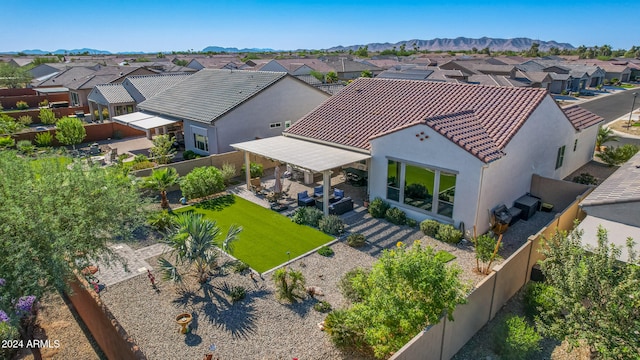 birds eye view of property featuring a mountain view