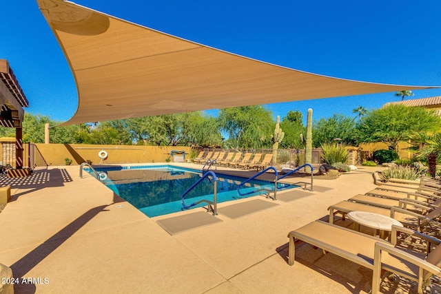 view of swimming pool with a patio area