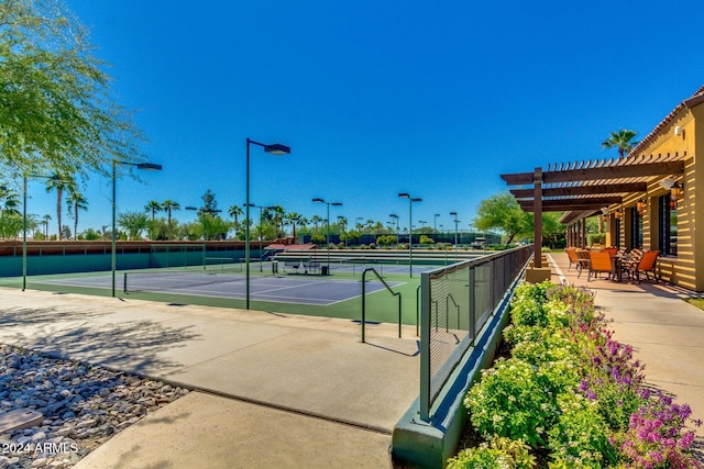 view of sport court with a pergola