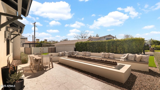 view of patio featuring an outdoor living space, outdoor dining area, and fence