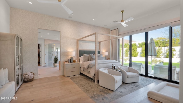 bedroom with light wood-style flooring, a ceiling fan, recessed lighting, wallpapered walls, and access to exterior