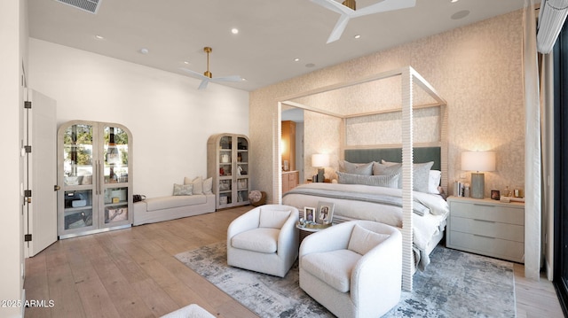 bedroom featuring wallpapered walls, recessed lighting, visible vents, and wood-type flooring