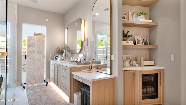 bathroom featuring vanity and visible vents