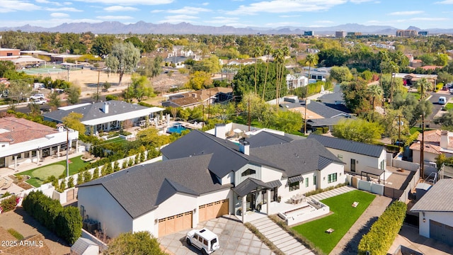 drone / aerial view featuring a residential view and a mountain view