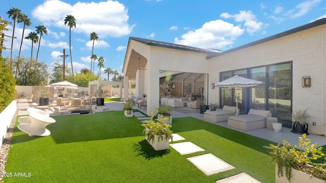 view of yard with a patio area, an outdoor hangout area, and fence