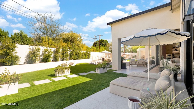 view of yard featuring an outdoor hangout area, a fenced backyard, and a patio area