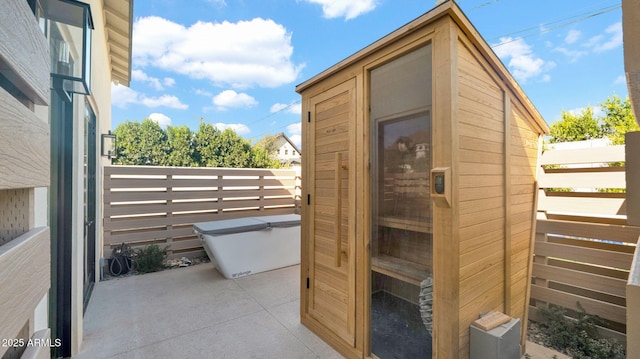 view of shed with fence