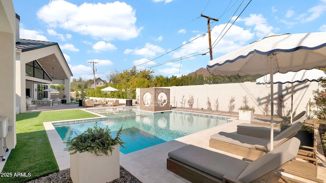 view of pool with a patio area, a fenced in pool, outdoor lounge area, and a fenced backyard