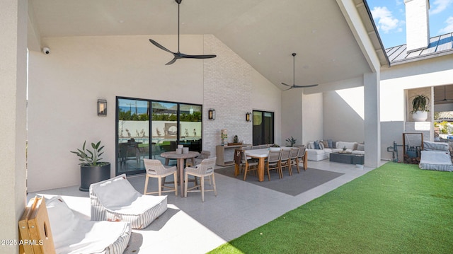 view of patio / terrace featuring an outdoor living space, outdoor dining area, and a ceiling fan