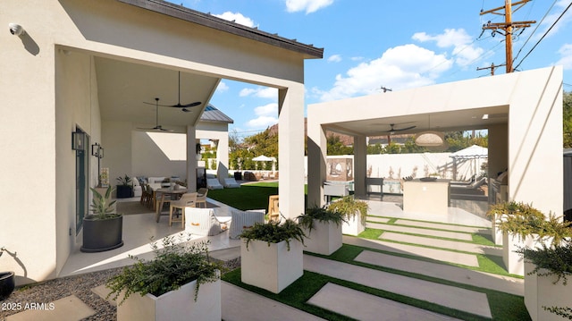 view of patio featuring a ceiling fan