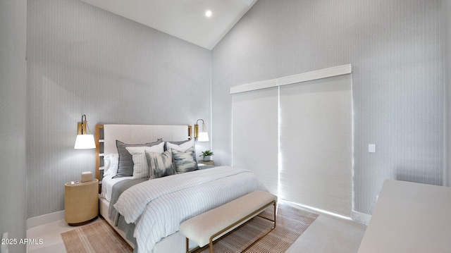 bedroom with recessed lighting, a closet, and high vaulted ceiling