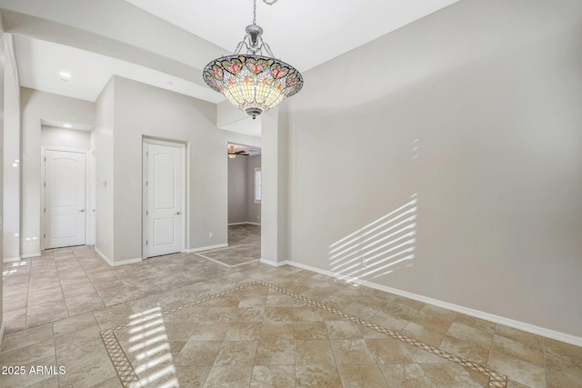 unfurnished dining area featuring baseboards