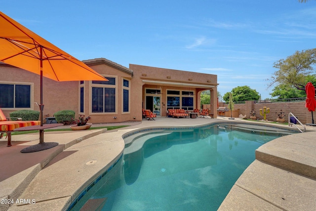 view of pool with a fenced in pool, a patio area, and a fenced backyard