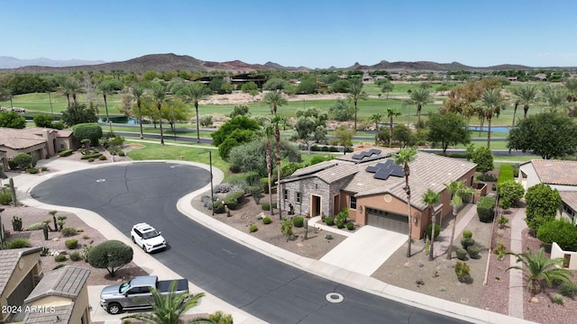 birds eye view of property featuring a mountain view