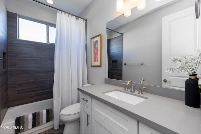 full bathroom featuring vanity, toilet, and shower / tub combo with curtain