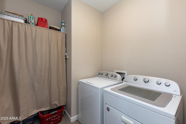 clothes washing area with washer and dryer