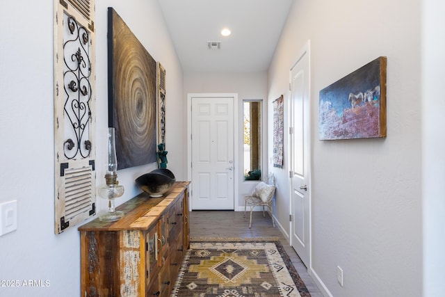 doorway to outside with dark wood-type flooring